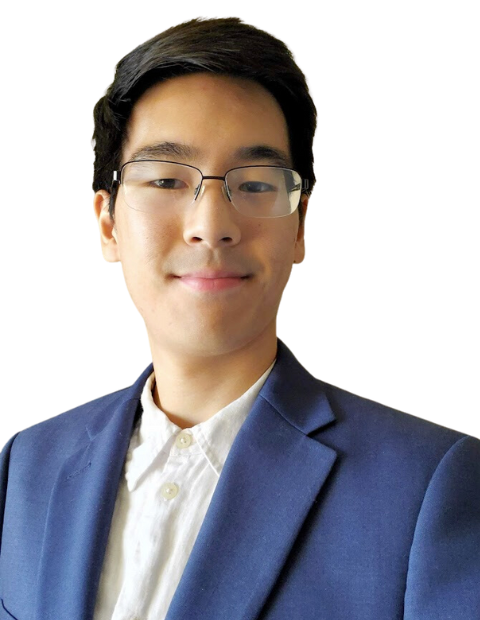 Michael Kim in a white button-up shirt with a navy suit